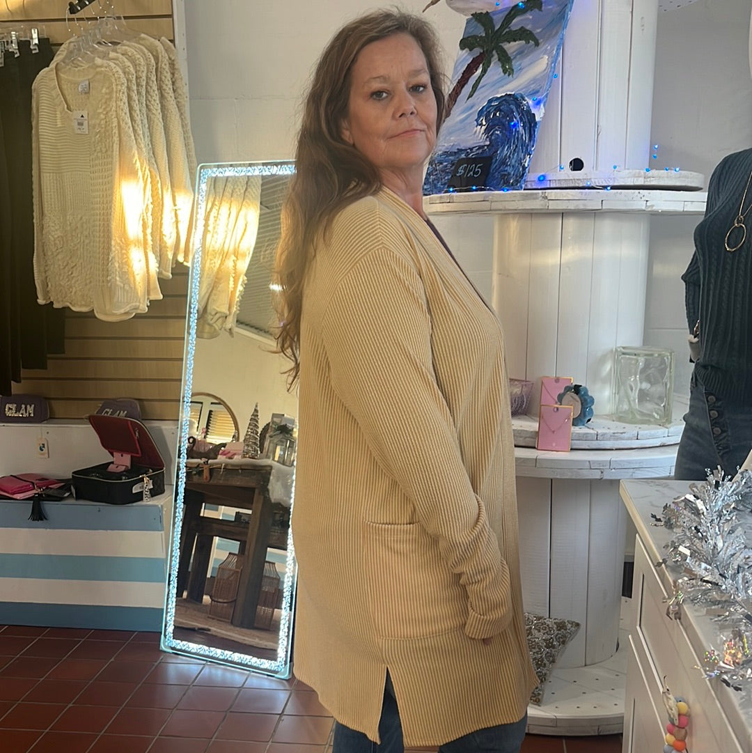 Reece Ribbed Cardigan available in sizes One Size and Plus Size. Brand: Blakely. 80% Polyester, 16% Rayon, 5% Spandex. Black.