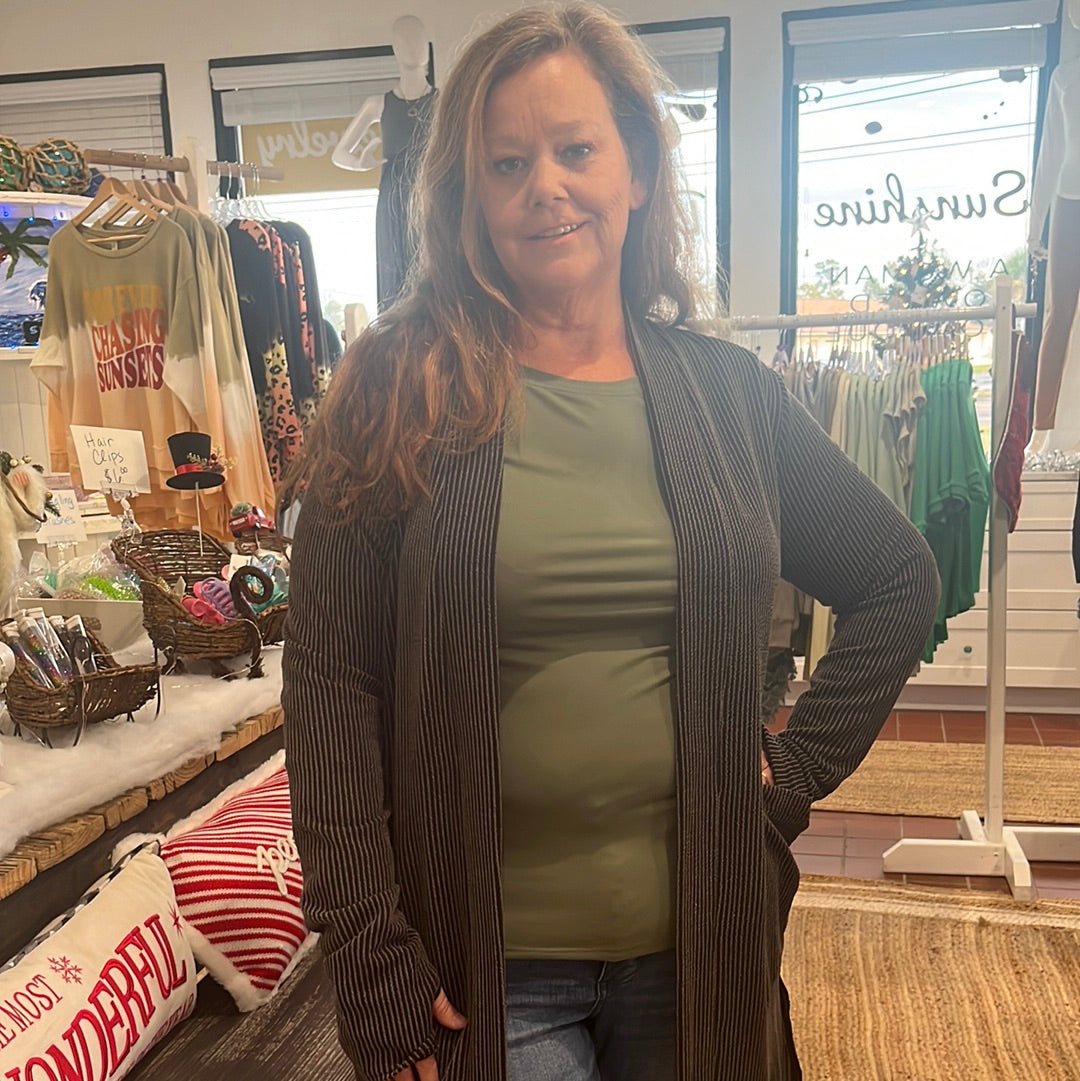 Reece Ribbed Cardigan available in sizes One Size and Plus Size. Brand: Blakely. 80% Polyester, 16% Rayon, 5% Spandex. Black.