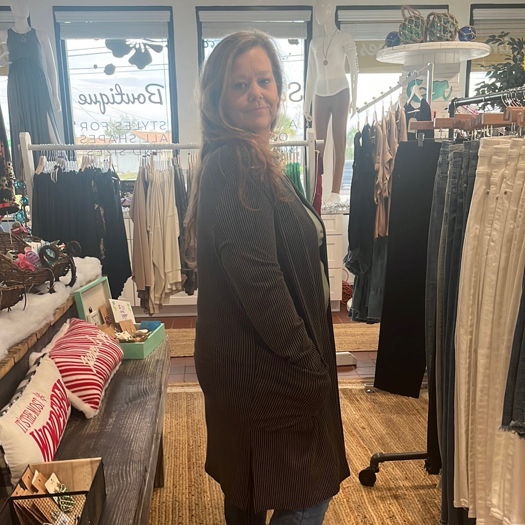 Reece Ribbed Cardigan available in sizes One Size and Plus Size. Brand: Blakely. 80% Polyester, 16% Rayon, 5% Spandex. Black.