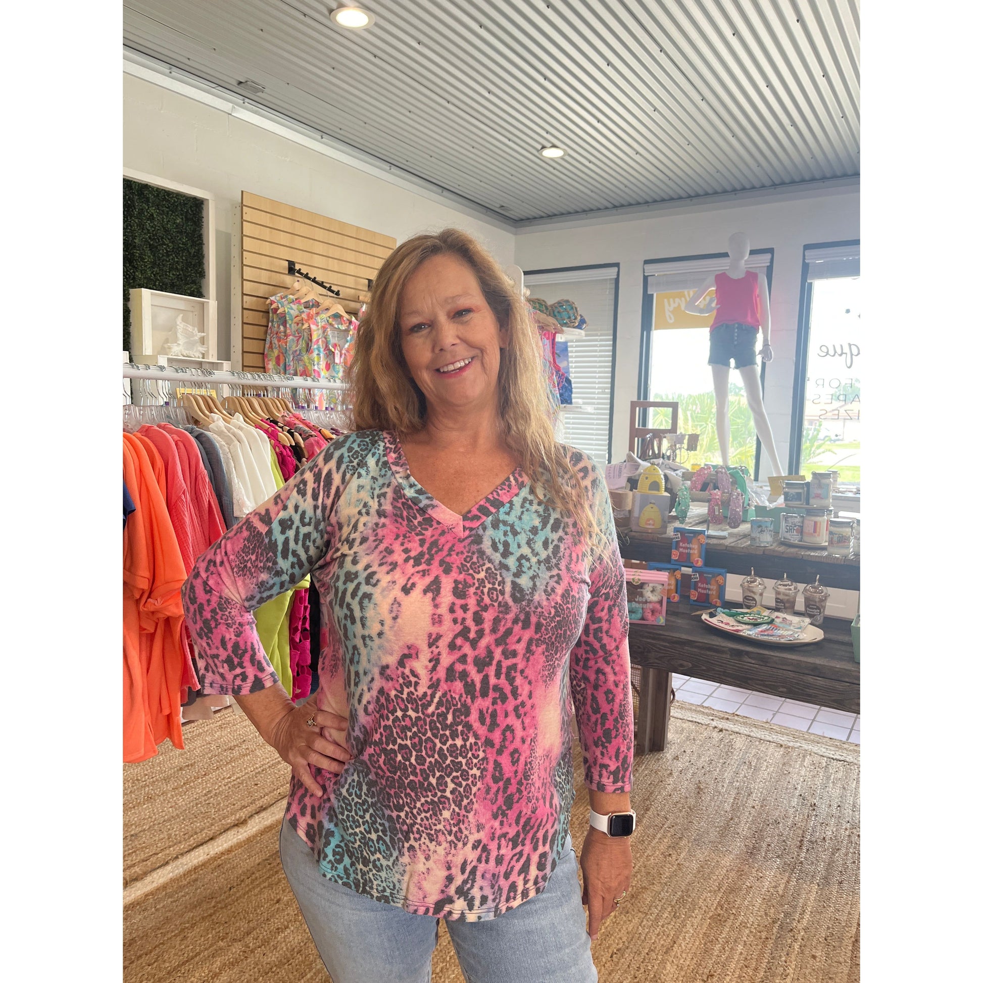 3/4 sleeve Animal Print V-Neck Top, available in sizes Small through Large.  65% Polyester, 32% Rayon.  Brand: Dear Scarlett.