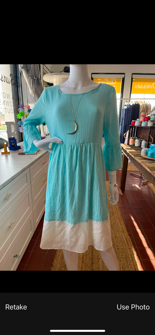 Sky blue 3/4 sleeve dress available in sizes Small through Large. 100% Polyester