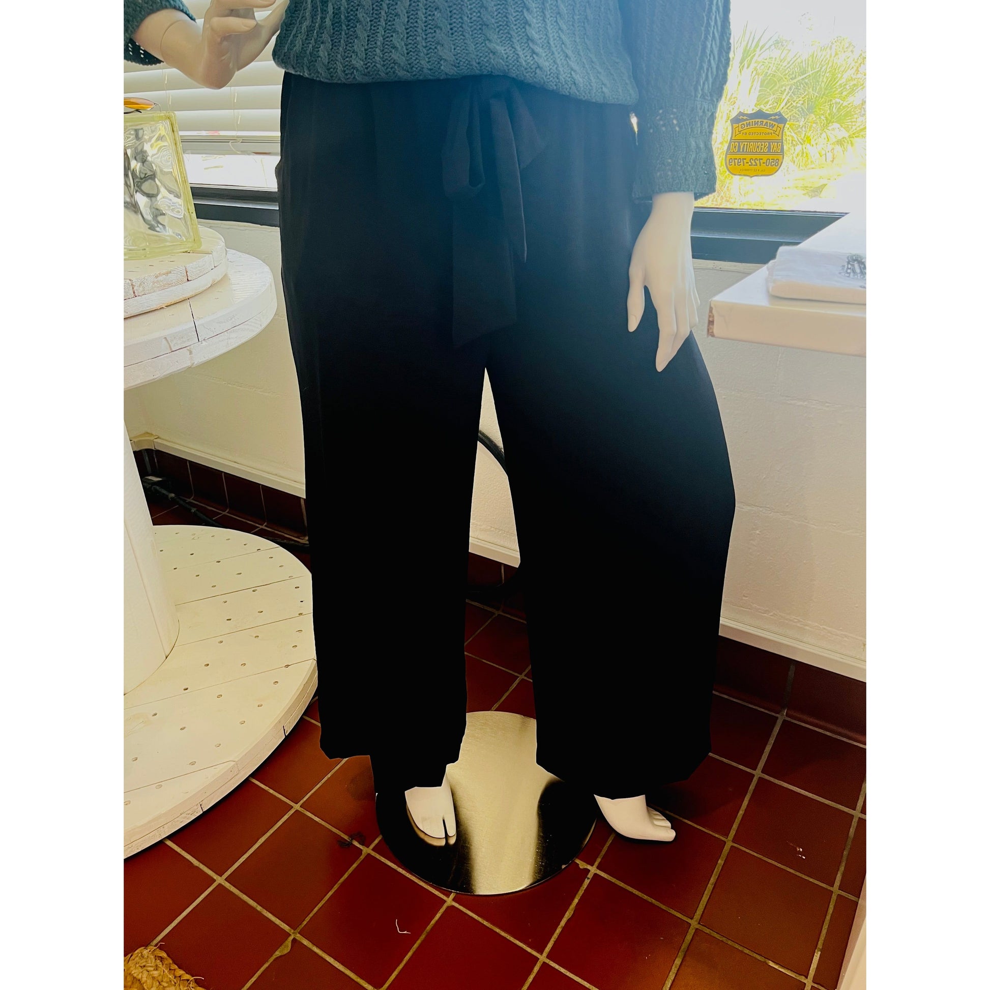 Wide leg Black Pants with tie waist. 100% Polyester.  Available in sizes Small through 3X. Inseam: 27.5" Brand: White Birch  
